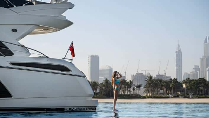 girl standing near yacht
